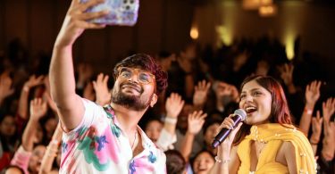 Mahesh Kafle and Asmita Adhikari Taking Selfie on the stage during the Soulful USA Musical Yatra