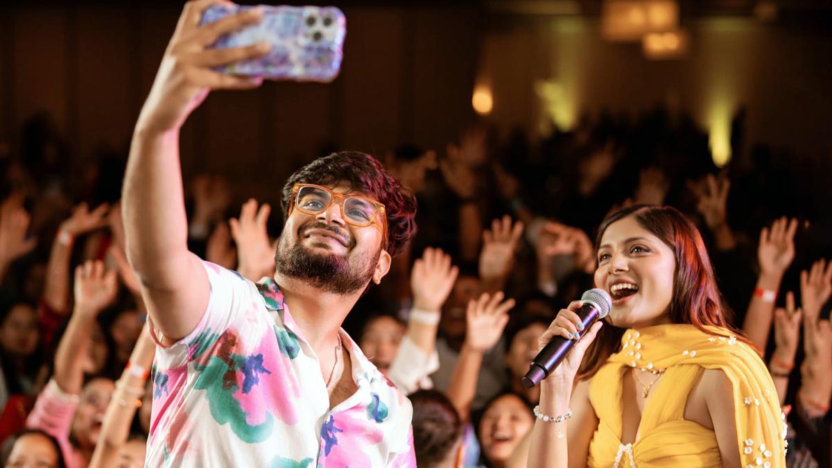 Mahesh Kafle and Asmita Adhikari Taking Selfie on the stage during the Soulful USA Musical Yatra