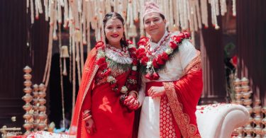 Subekshya Khadka and Ashwasan Joshi posing in traditional Nepali wedding attire with garlands at their wedding ceremony